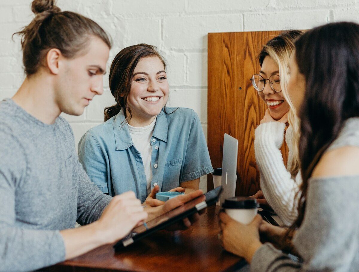 A supportive, diverse team collaborating together at Bluesky Brandworks